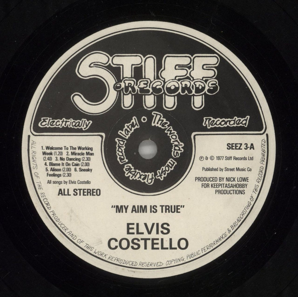 Elvis Costello My Aim Is True - Laminated - Yellow back - EX UK vinyl LP album (LP record) COSLPMY738189