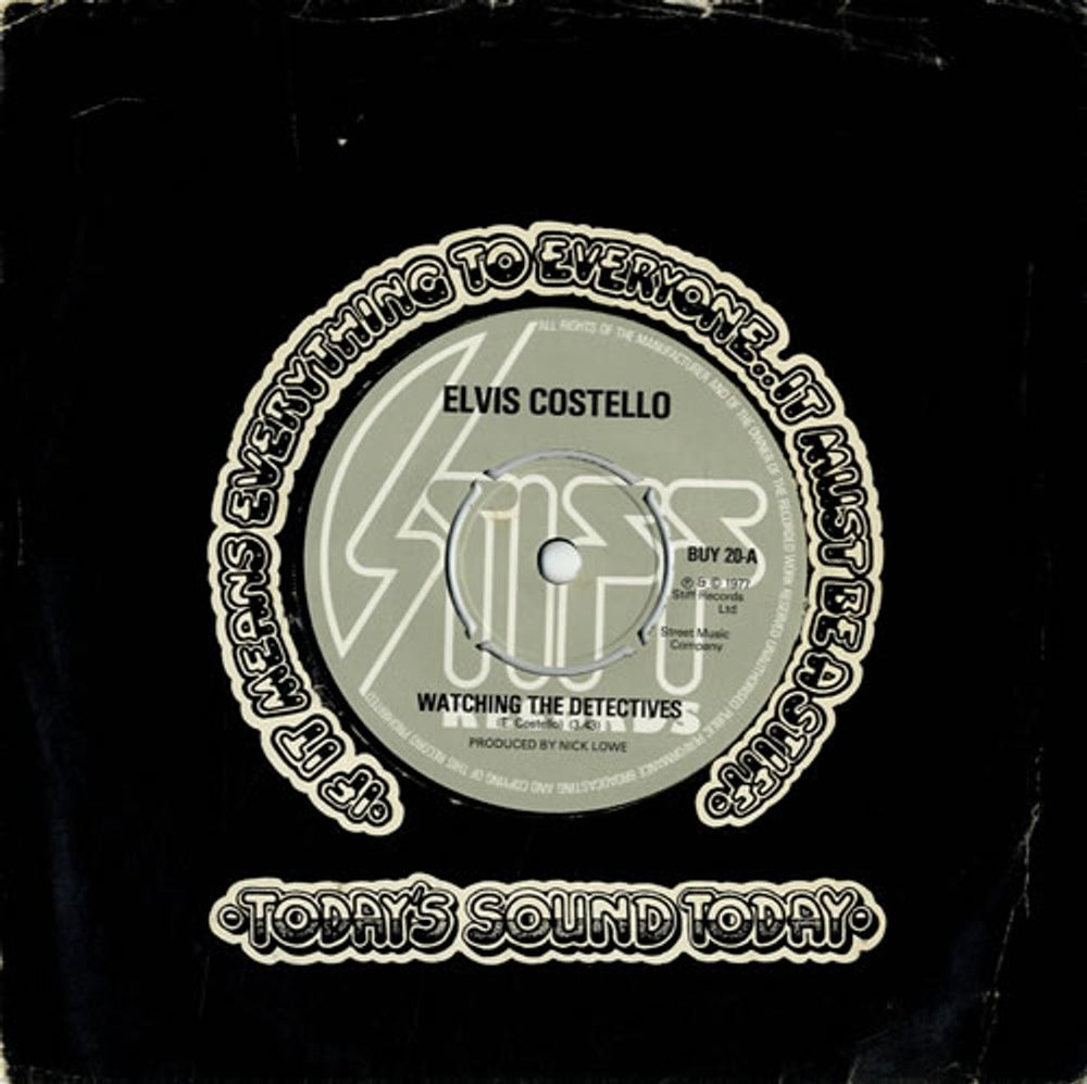Elvis Costello Watching The Detectives - 4-Prong UK 7" vinyl single (7 inch record / 45) BUY20