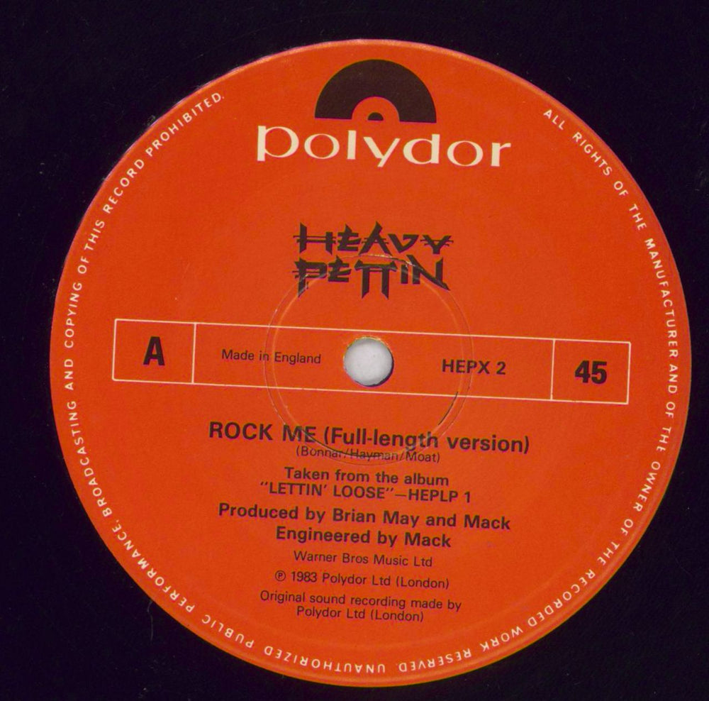 Heavy Pettin Rock Me - Patch UK 12" vinyl single (12 inch record / Maxi-single) HEV12RO828523